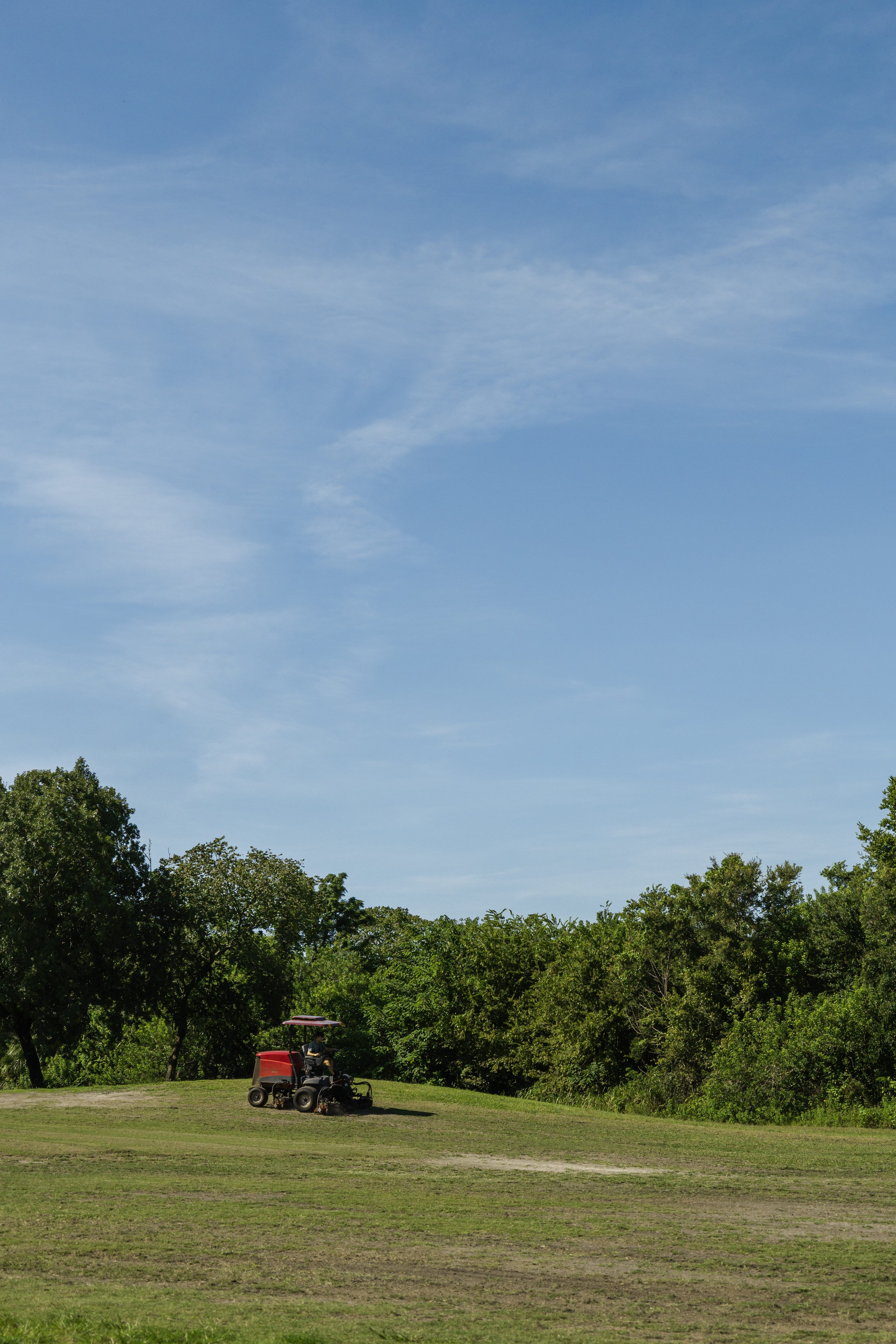 Lawn Mower in front of the lake